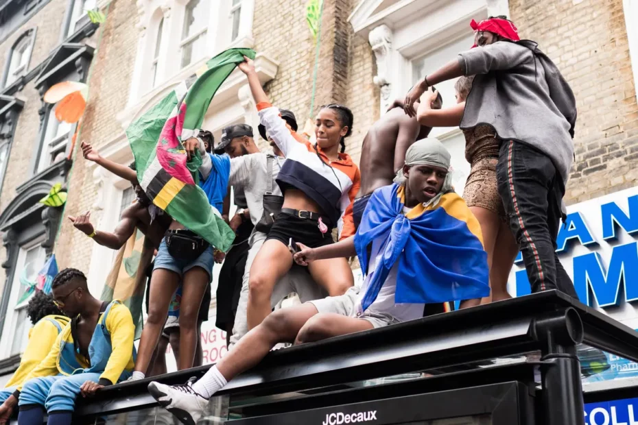 people on top of vehicle performing at a carnival